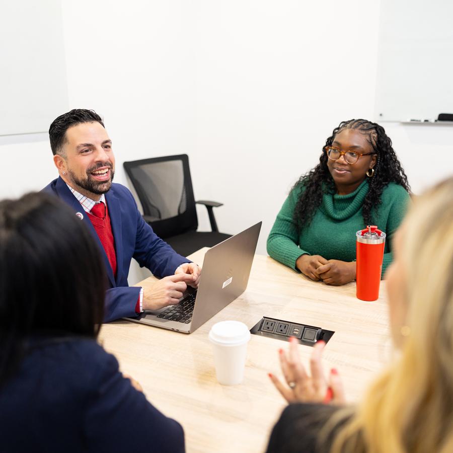 Group of Graduate students discussing their class